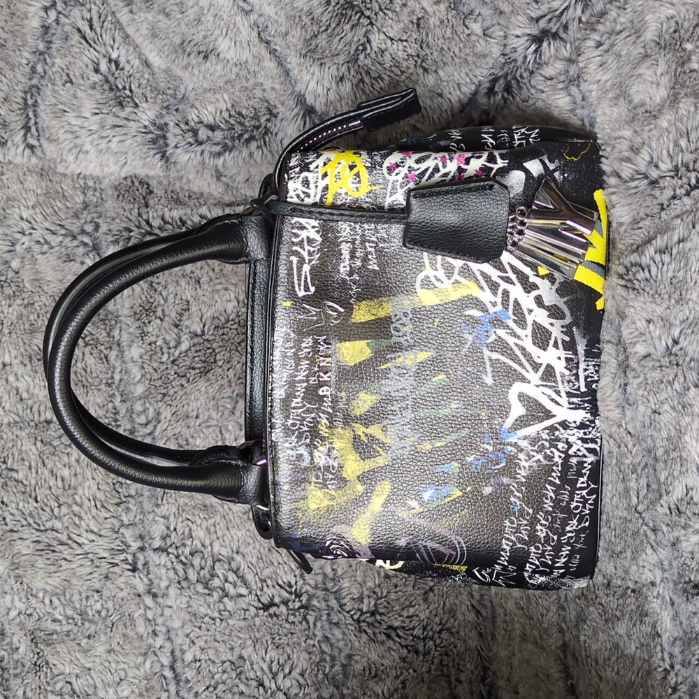 DKNY Paige small satchel crossbody handbag with a graffiti print.